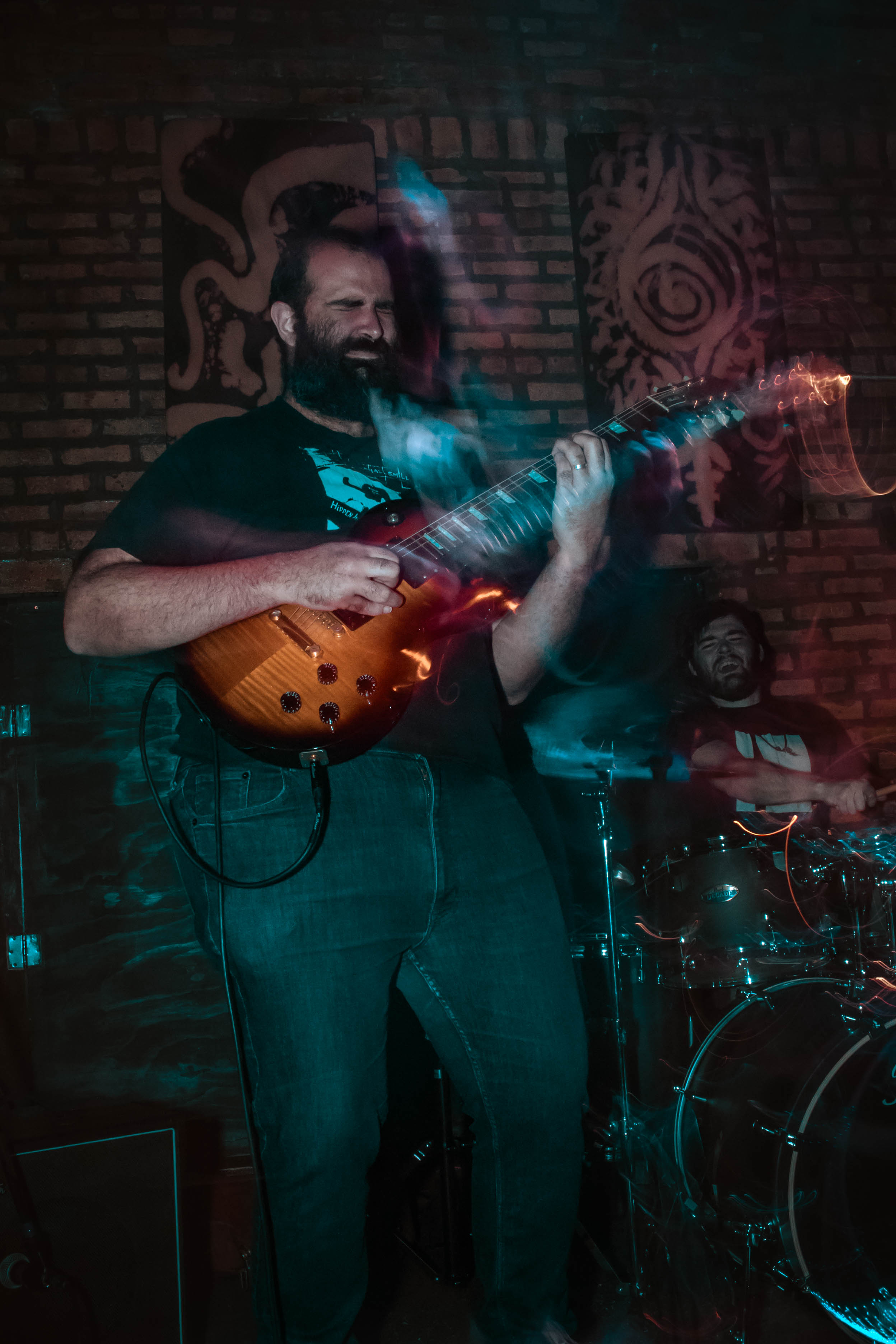 Marcos on guitar with Sam on drums behind